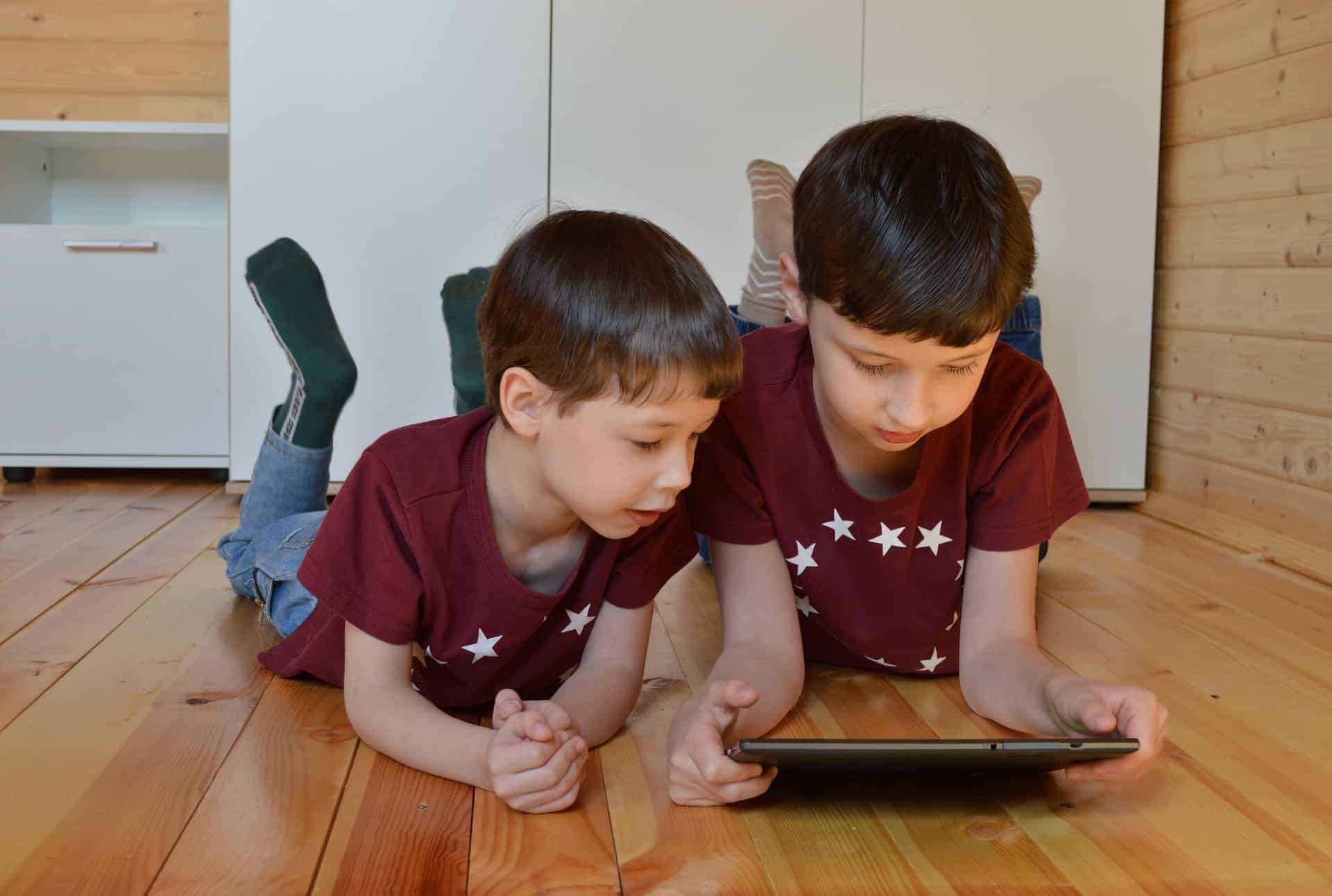 Two boys using a LeapFrog Epic Academy Edition app on a tablet